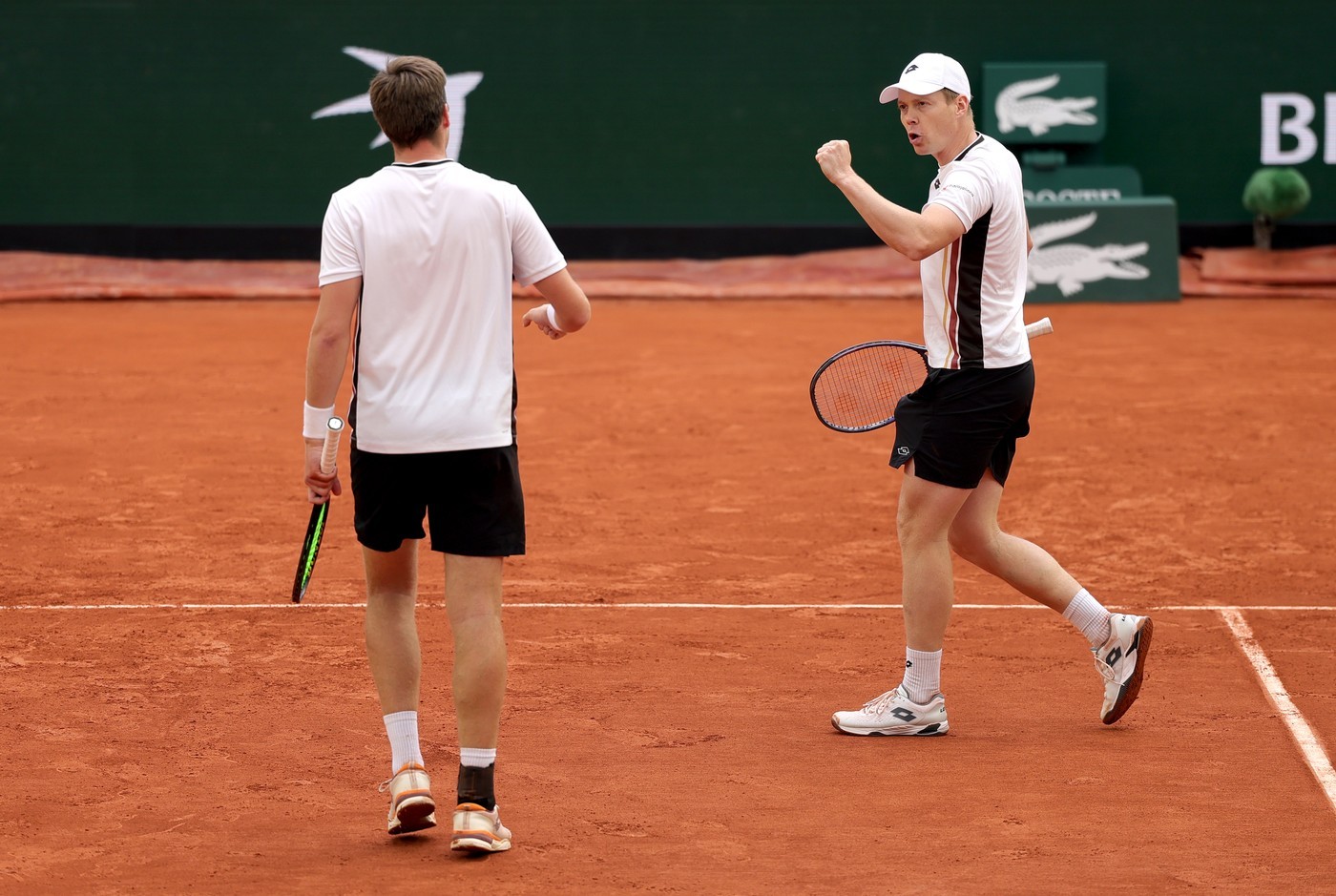Heliovaara (right) and Patten celebrate a point during their Semi-final win