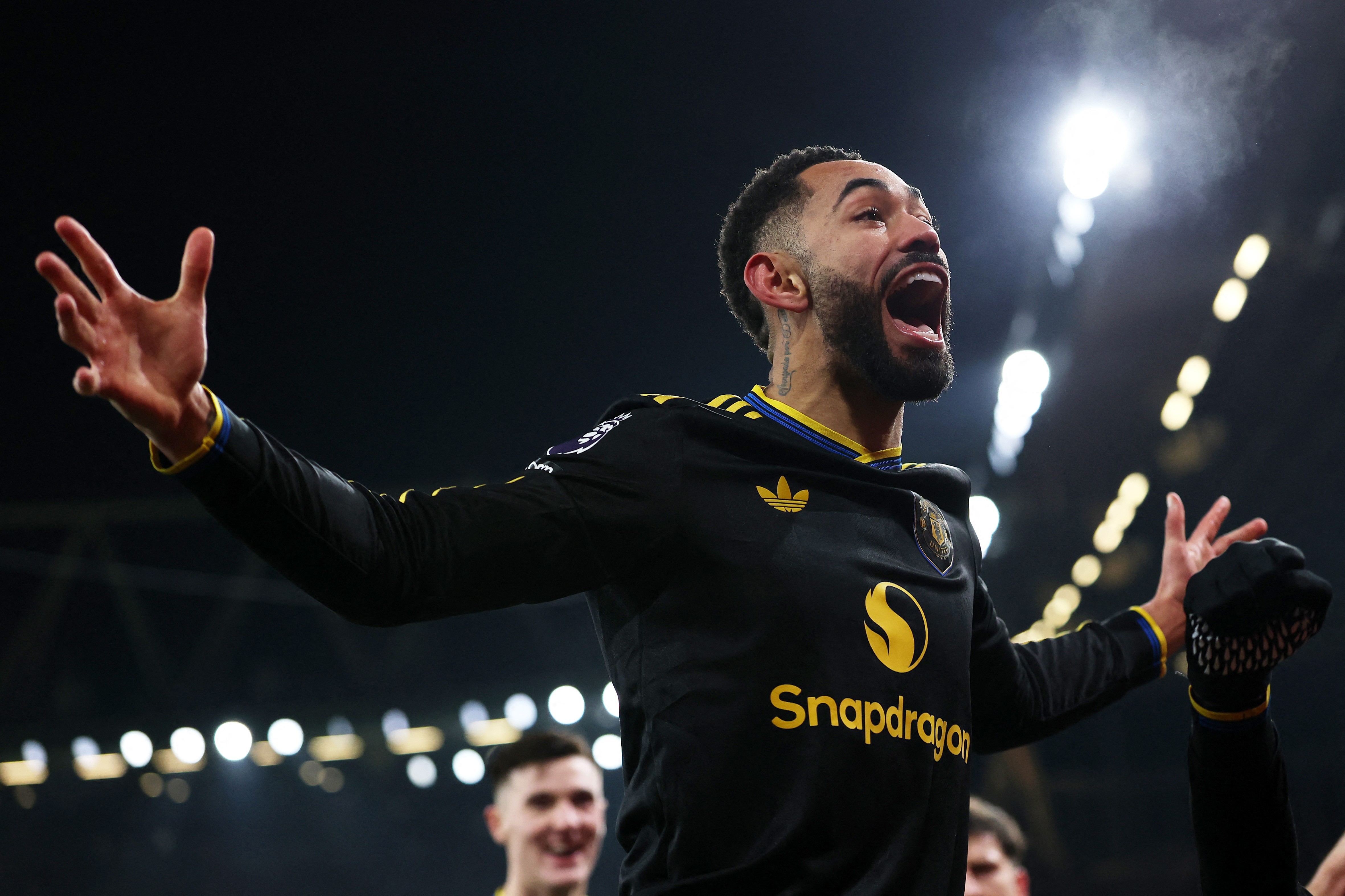 Matheus Cunha celebrates after giving Manchester United the late win