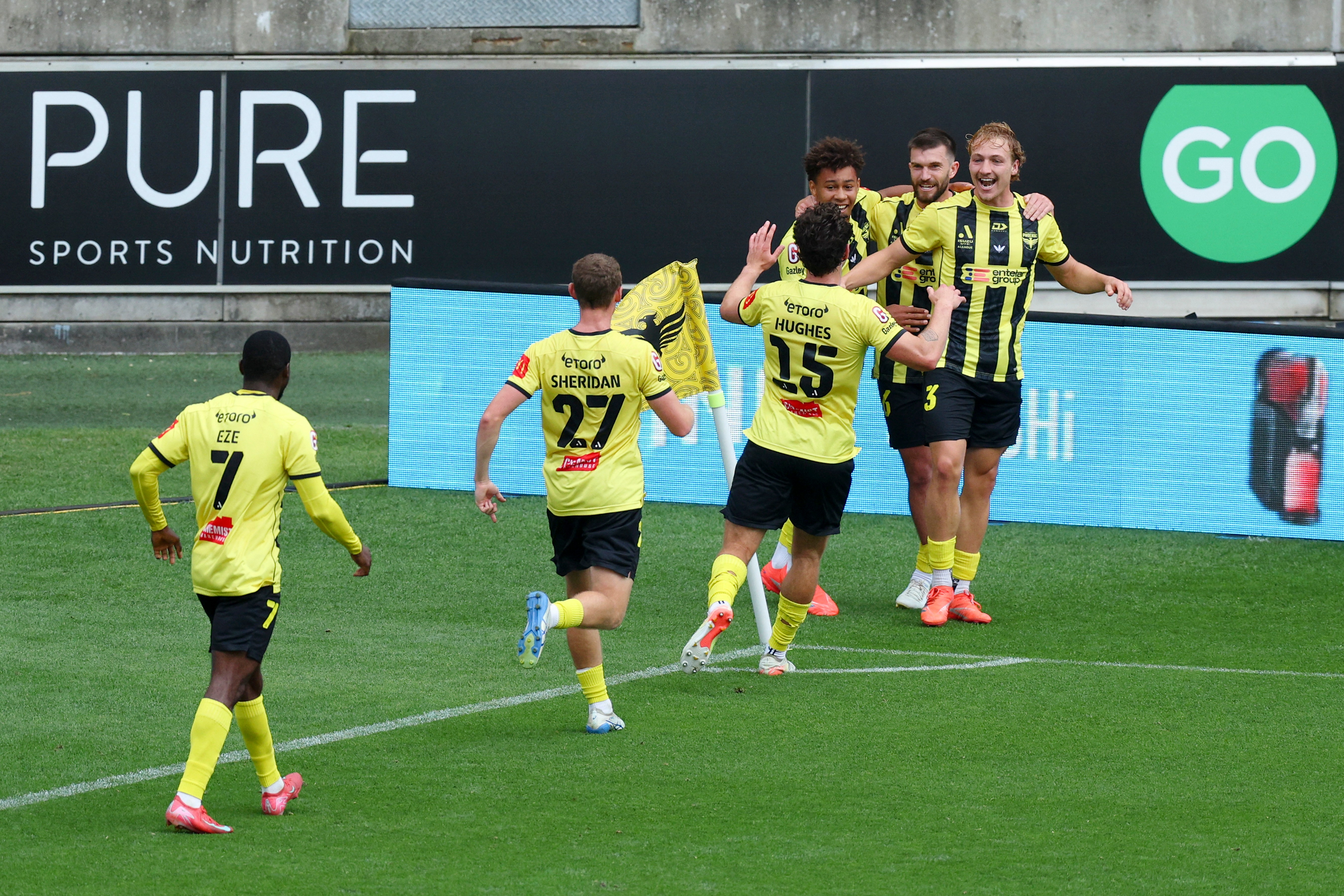 Corban Piper and his Wellington teammates celebrate their equaliser against Adelaide.