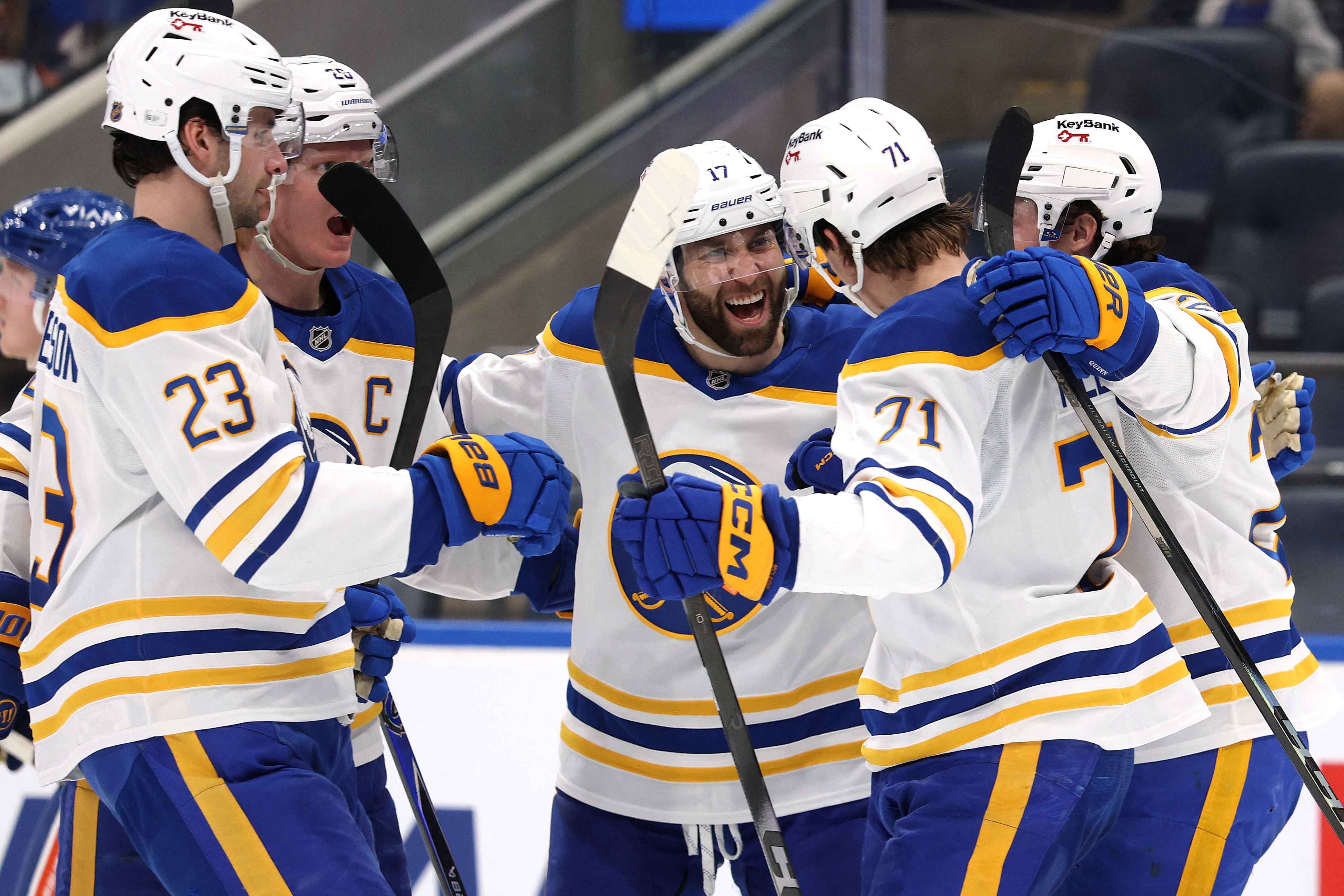 Buffalo Sabres players celebrate goal against New York Islanders