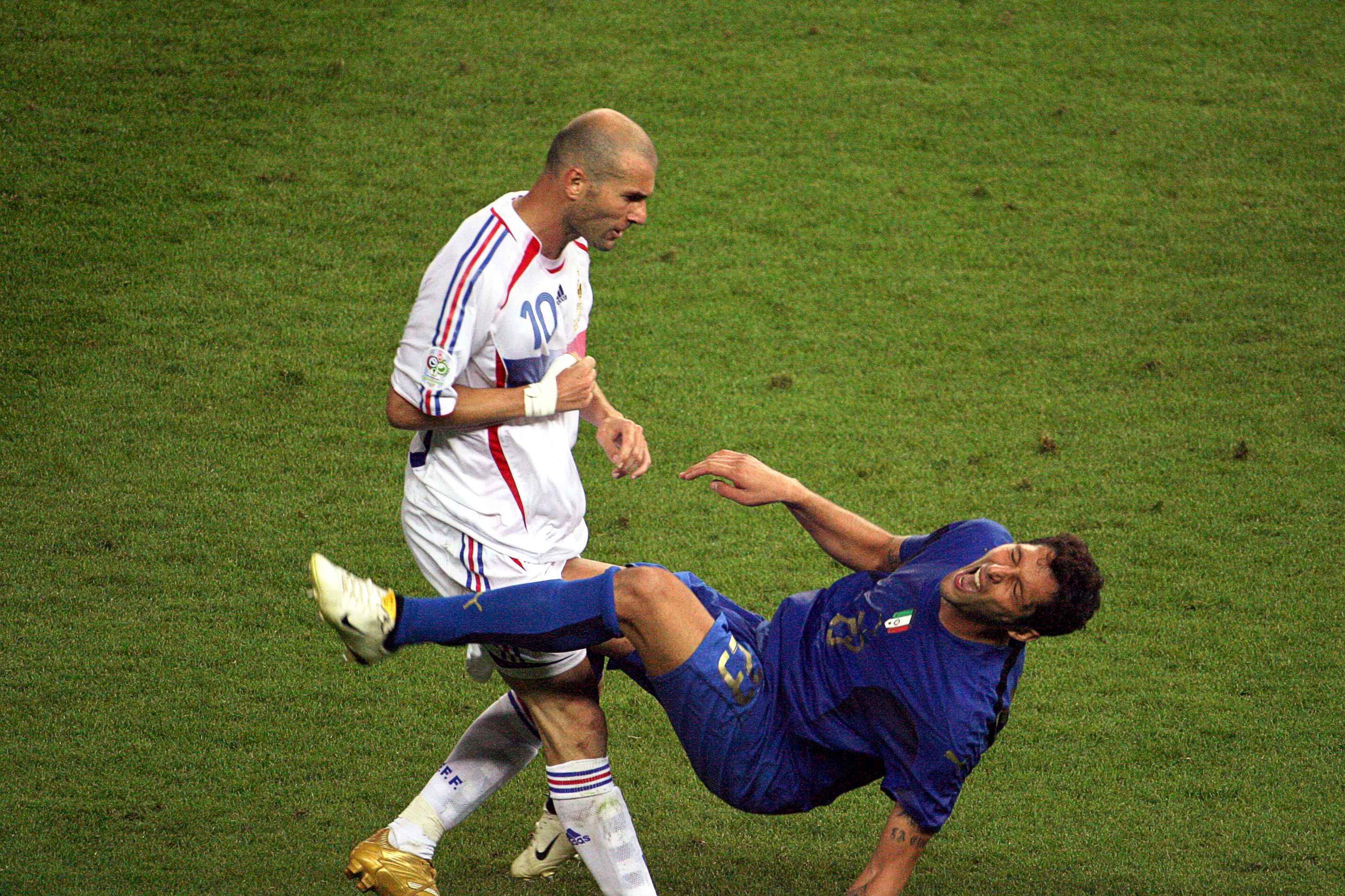 Italy's Marco Materazzi falls to the groud after receiving a head butt from France's Zinédine Zidane during the 2006 FIFA World Cup final