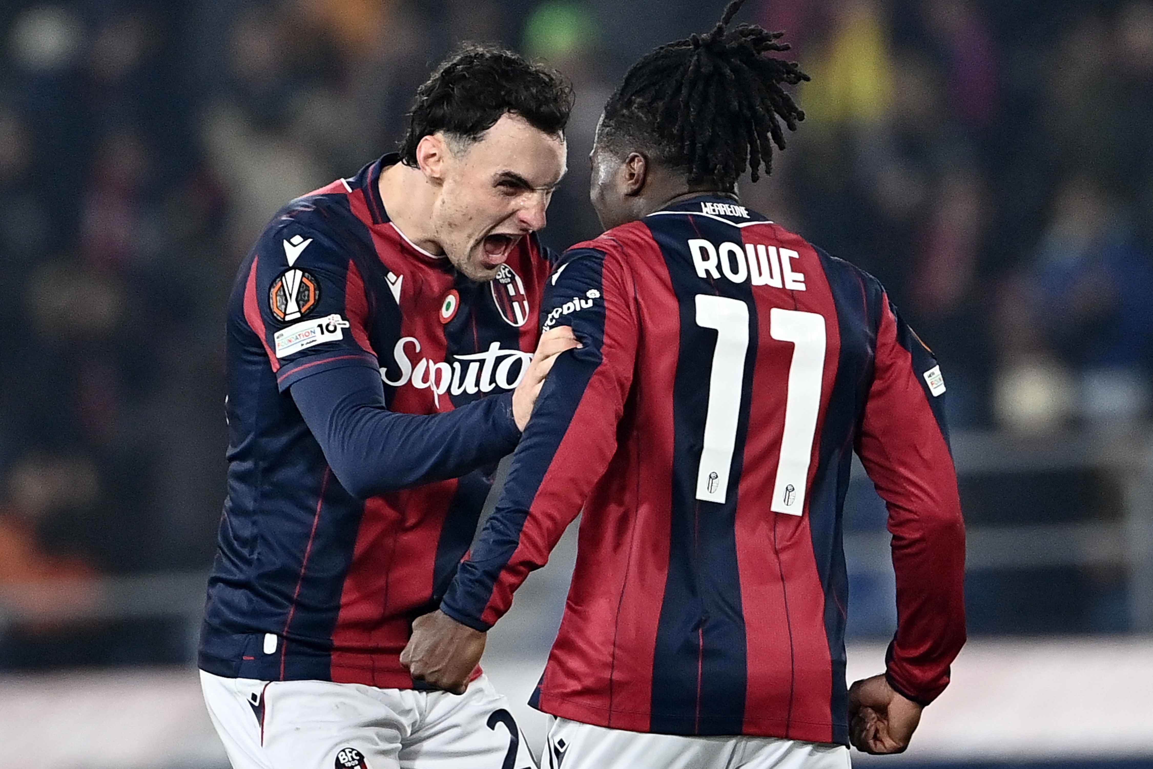 Jonathan Rowe celebrates scoring Bologna's second goal with Charis Lykogiannis
