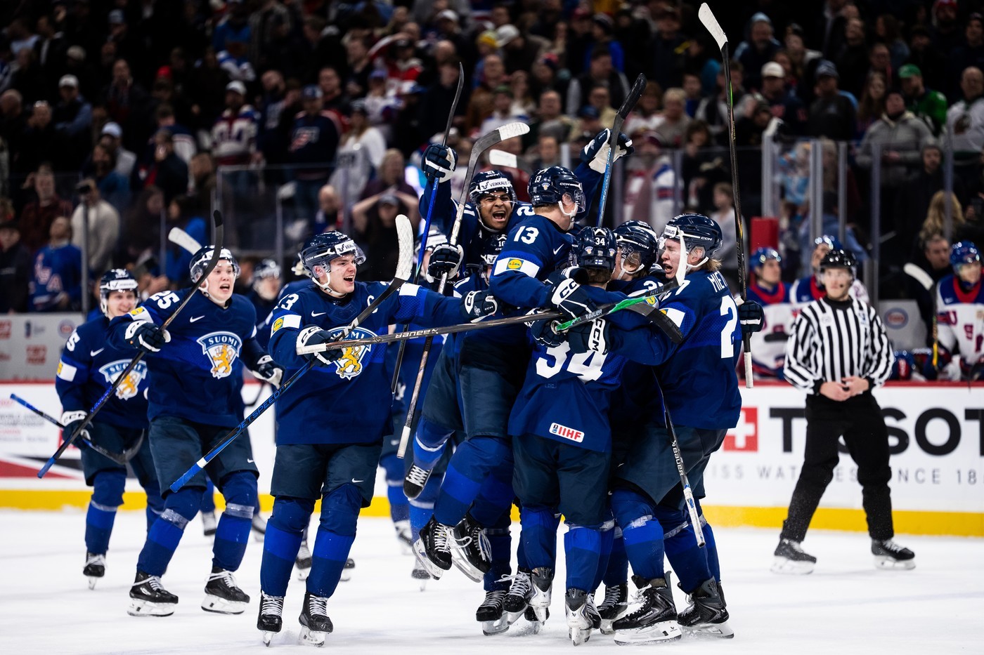 Finland celebrate their overtime winner against the USA