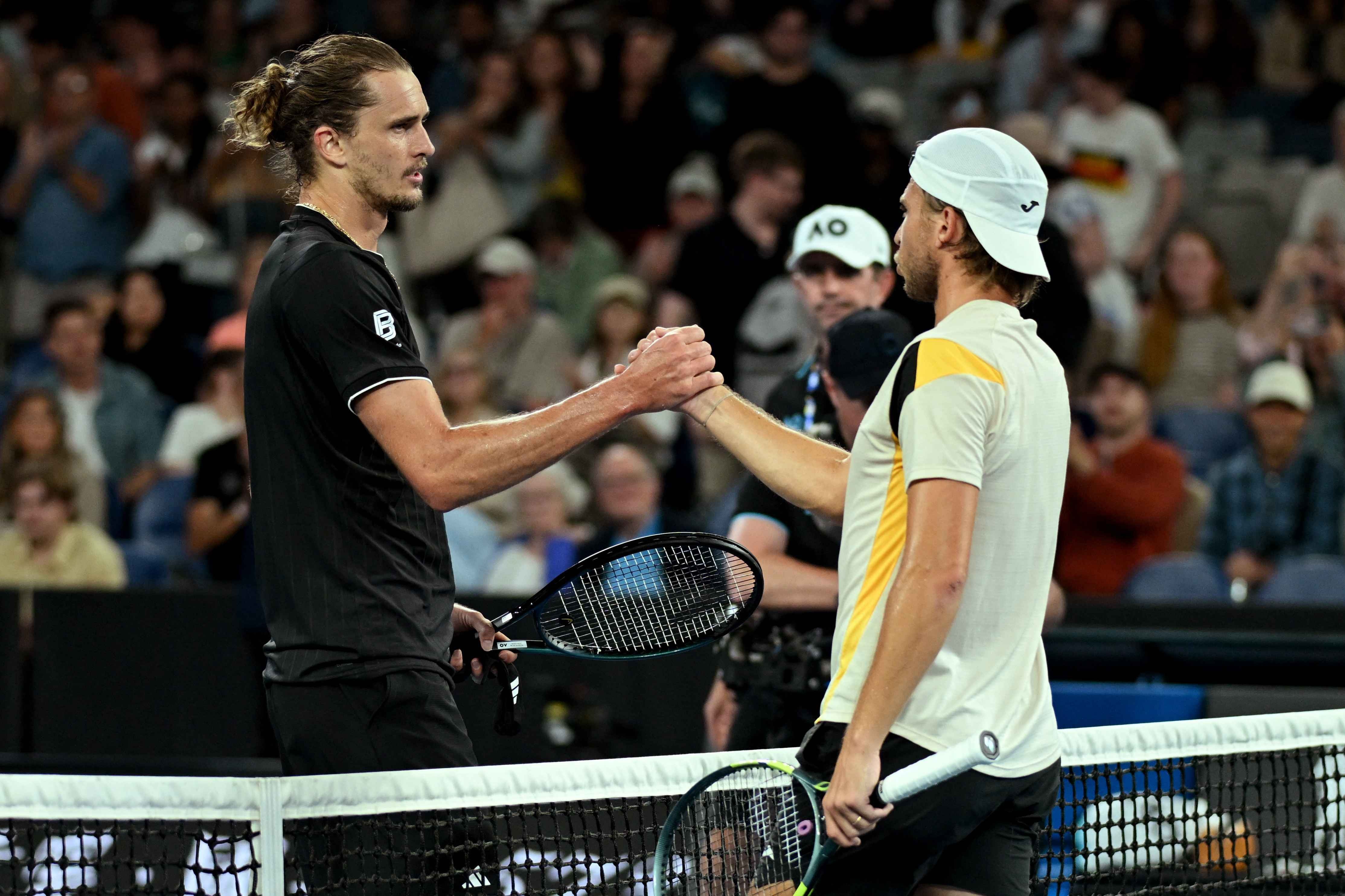 Zverev (left) is through to the third round in Melbourne