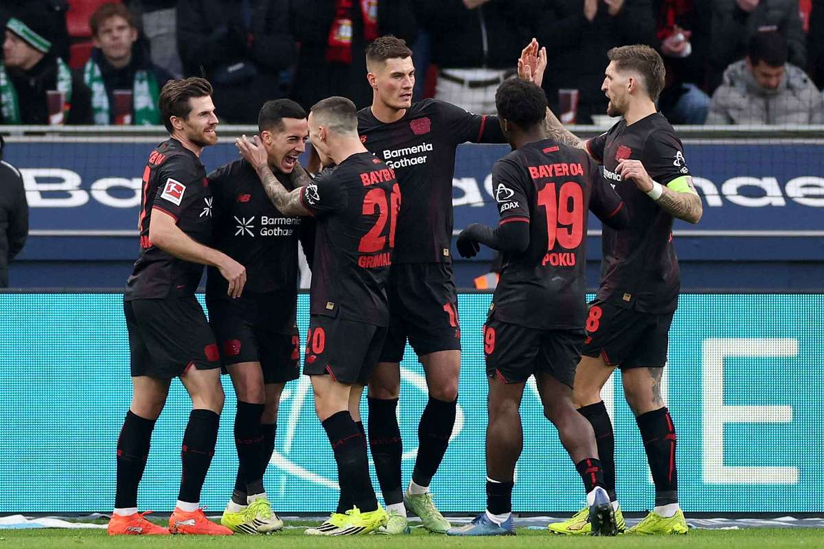 Bayer Leverkusen's players celebrate Lucas' first-half winner