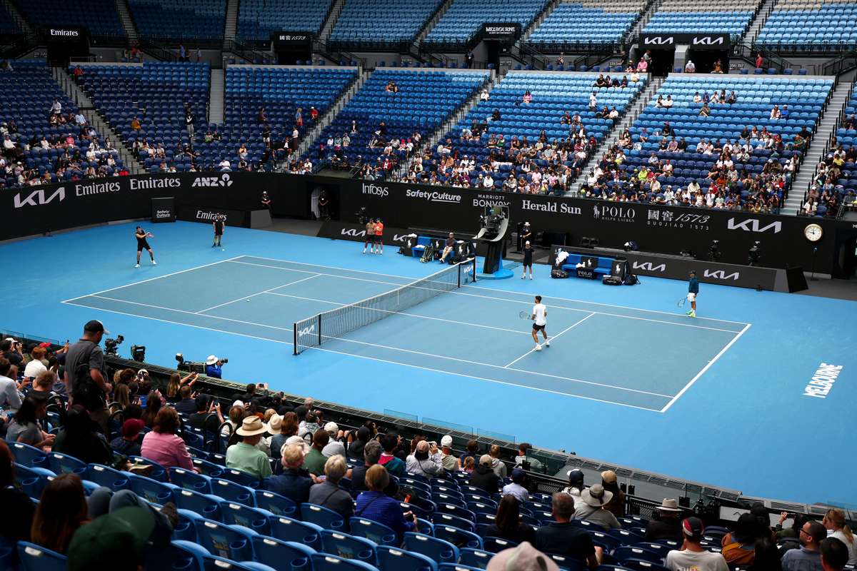 Carlos Alcaraz and Taylor Fritz train together at Rod Laver Arena on Tuesday.