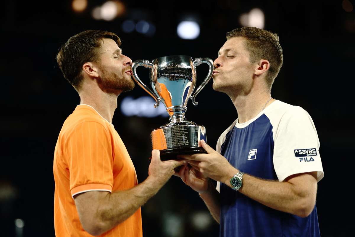Harrison and Skupski lift the doubles trophy together