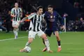 PSG's Achraf Hakimi (right) battles Newcastle's Sandro Tonali