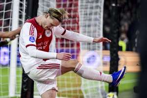 Ajax's Kasper Dolberg kicks the boarding out of frustration after another missed chance