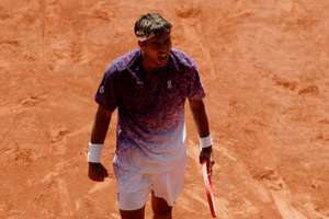 Flavio Cobolli celebrates after winning his fourth round match against Zachary Svajda