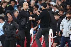 Pep Guardiola and Mikel Arteta shake hands