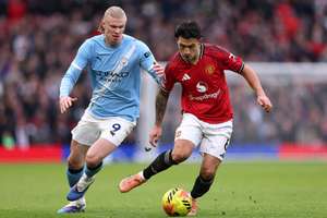 Lisandro Martinez of Manchester United is challenged by Erling Haaland of Manchester City
