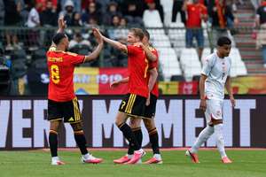 Belgium's Kevin De Bruyne celebrates scoring their third goal with teammates