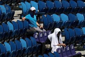 Few spectators were willing to brave the open air on Tuesday morning with crowds well down on previous days.  