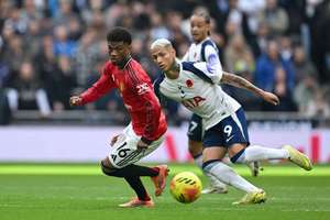 Manchester United's Amad Diallo holds off Tottenham Hotspur's Richarlison