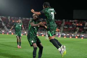 Osimhen and Lookman celebrate during Nigeria's thumping win