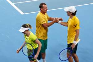 De Minaur (R) celebrates with team captain Hewitt