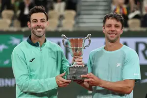 Spain's Marcel Granollers and Argentina's Horacio Zeballos celebrate with the trophy after winning their men's doubles final