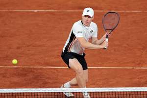 Heliovaara at the net in the Men's Doubles Final at Roland Garros