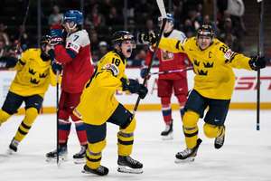 Sweden celebrate one of their goals in the final of the World Junior Championship
