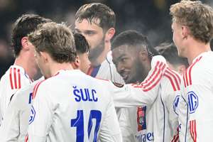 Lyon's Ainsley Maitland-Niles celebrates with teammates after scoring against Young Boys