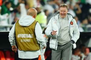 Koeman (R) reacts during the defeat to Algeria
