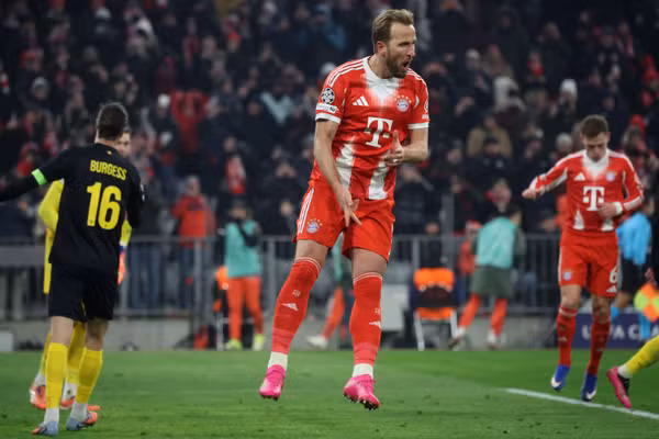 Harry Kane celebrates one of his two goals for Bayern Munich