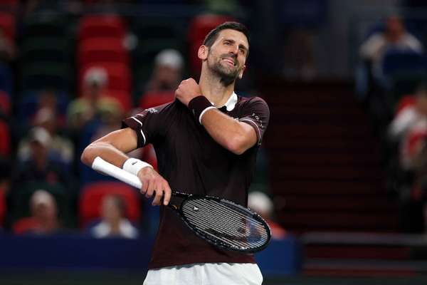 Djokovic reacts during a match at the Shanghai Masters