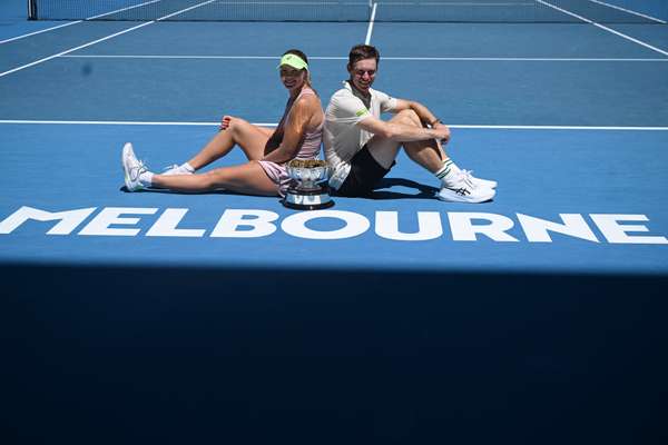 Olivia Gadecki and John Peers pose with the Australian Open mixed doubles trophy.