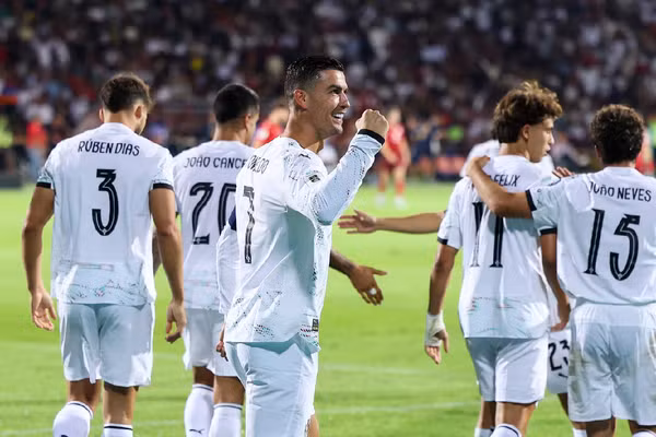 CR7 Shines: Portugal Honors Jota with Double Performance Cristiano Ronaldo celebrates a goal
