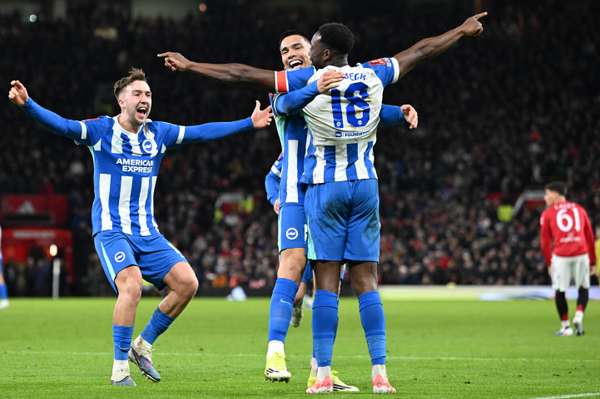 Danny Welbeck celebrates with teammates after scoring Brighton's second goal