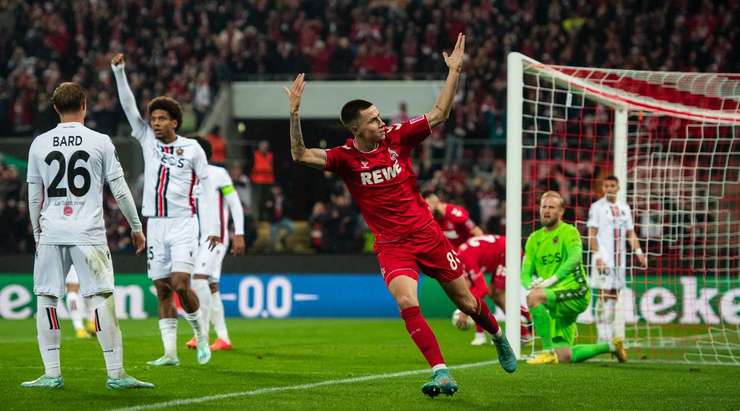 Vào! Một đường chuyền ngang đơn giản của Kristian Pedersen đưa bóng đến chân Denis Huseinbasic (Köln) bên trong vòng cấm, anh chỉnh lại tư thế và quất chân đưa bóng đi chìm vào chính giữa khung thành. Tỉ số là 1:2.