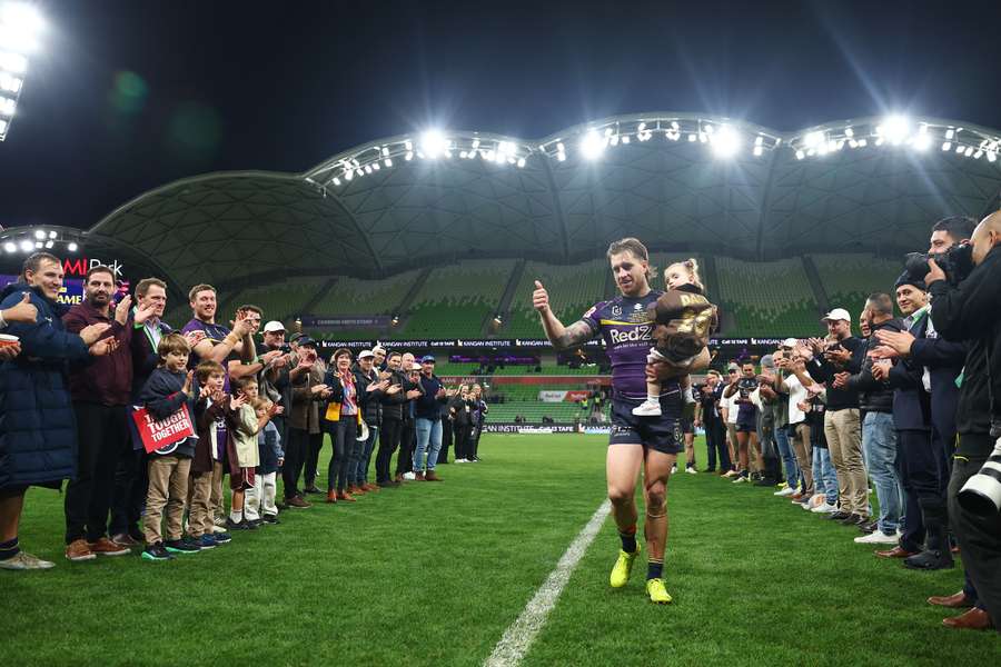 Cameron Munster with family and fans after his 250th NRL game earlier this year. Cameron Munster with family and fans after his 250th NRL game earlier this year.