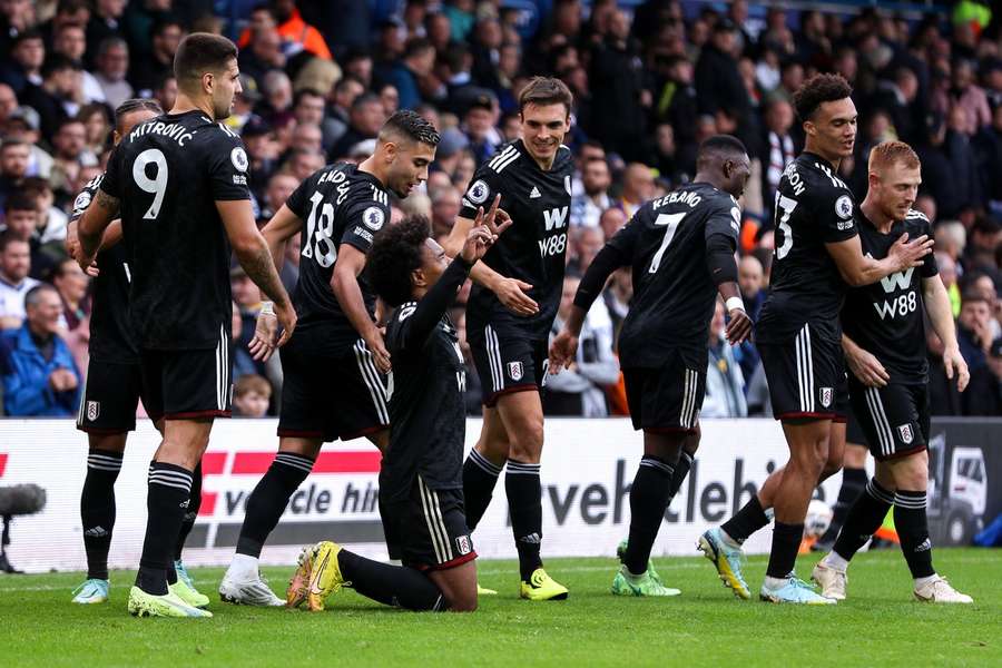 Willian celebrates his late winner against Leeds