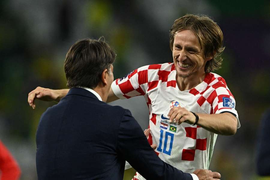 Coach Zlatko Dalic and captain Luka Modric celebrate their big win