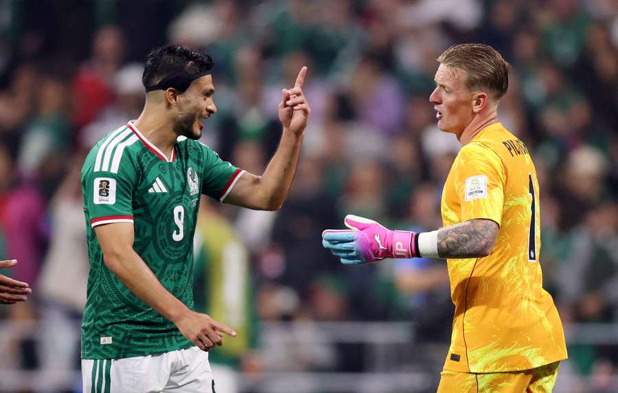 England's Jordan Pickford with Mexico's Raul Jimenez England's Jordan Pickford with Mexico's Raul Jimenez