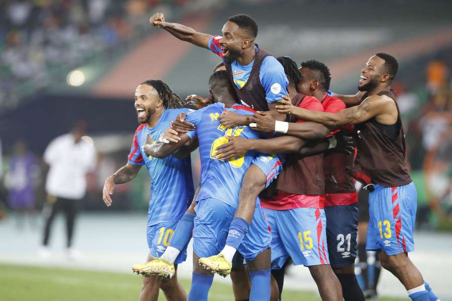 D.R. Congo players celebrate after scoring during their quarter-final with Guinea