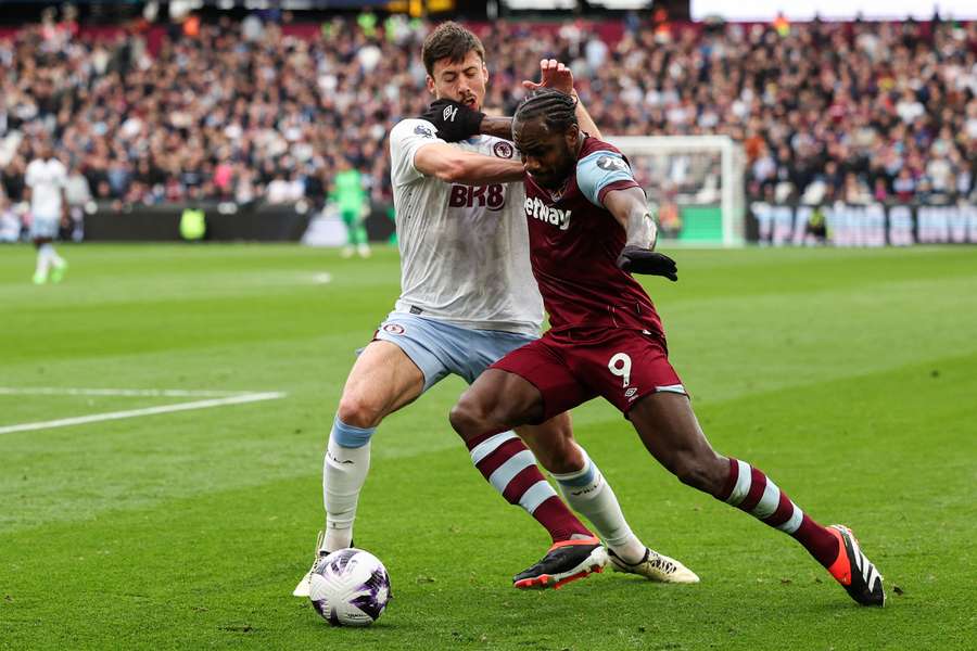 West Ham United midfielder Michail Antonio (R) tackles Aston Villa defender Clement Lenglet