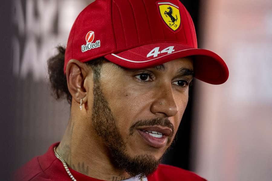 Ferrari's British driver Lewis Hamilton speaks during a TV interview