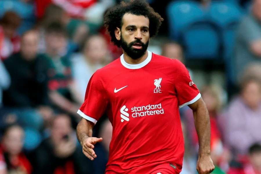 Mohamed Salah celebrates scoring the opening goal against Girona