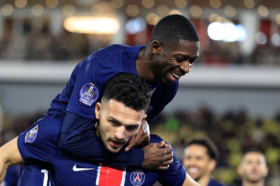 Portuguese forward #09 Goncalo Ramos (Bottom) celebrates scoring his team's third goal with Ousmane Dembele