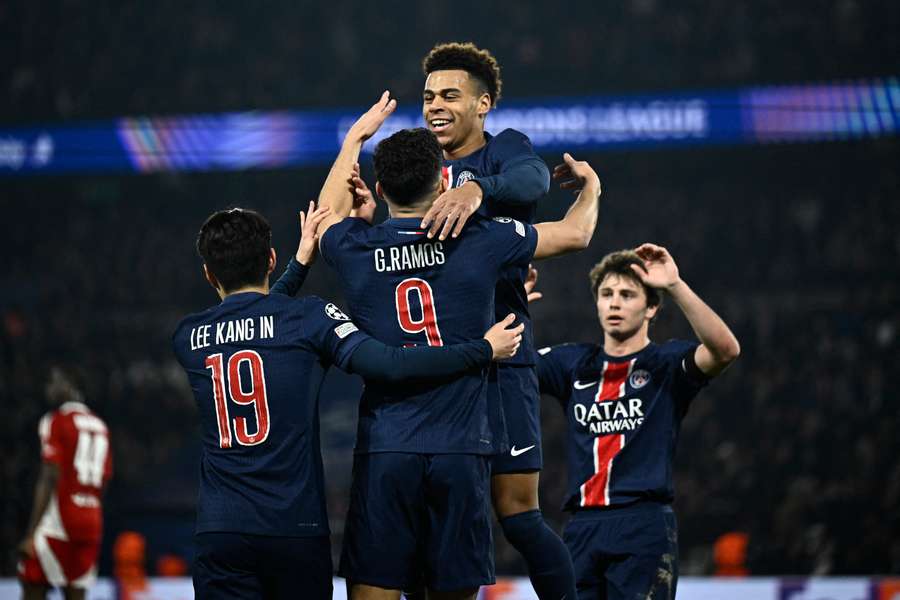 Desire Doue (centre) celebrates with teammates after scoring PSG's 
fourth goal against Brest