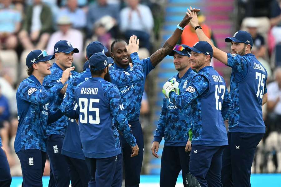 England's Jofra Archer celebrates with teammates after taking the wicket of South Africa's Ryan Rickelton