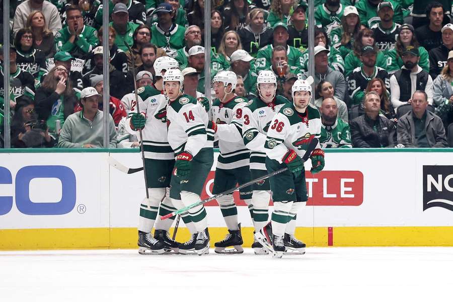 Minnesota Wild players celebrate goal in Game 1 against Dallas Stars