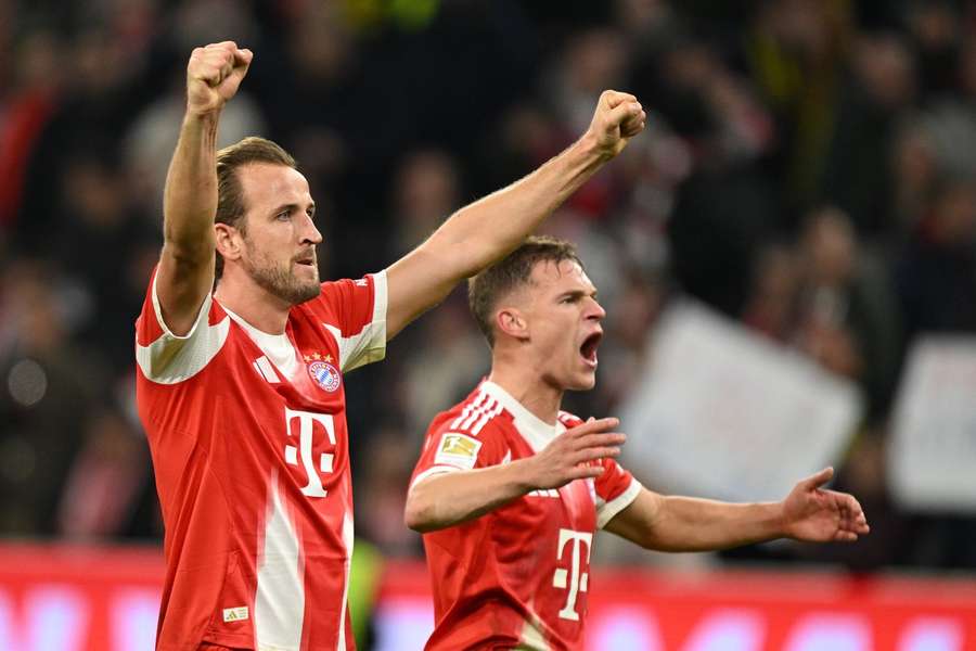 Bayern's Harry Kane, left, and Bayern's Joshua Kimmich celebrate their victory 