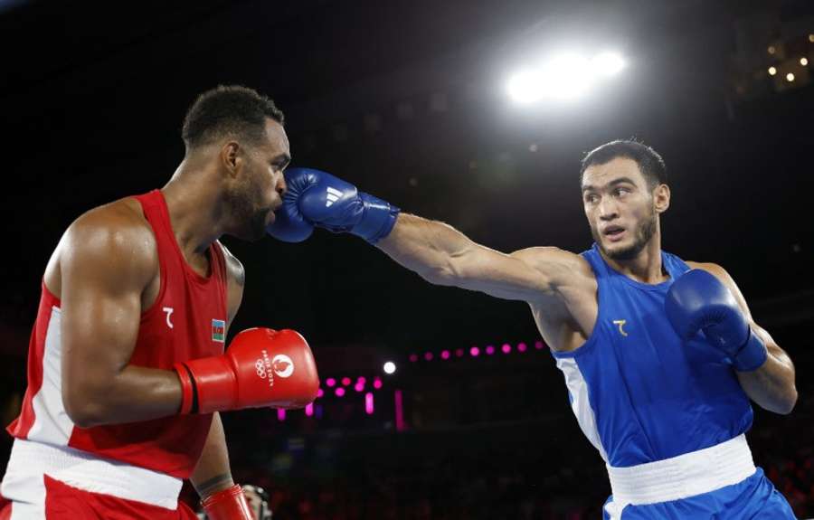 Lazizbek Mullojonov of Uzbekistan in action against Loren Berto Alfonso Dominguez of Azerbaijan