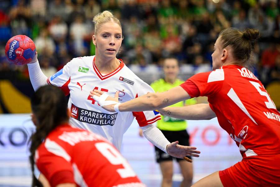 Hungary's Reka Bordas (R) in action against Denmark's Julie Scaglione during the EHF Women's Euro Cup handball match 