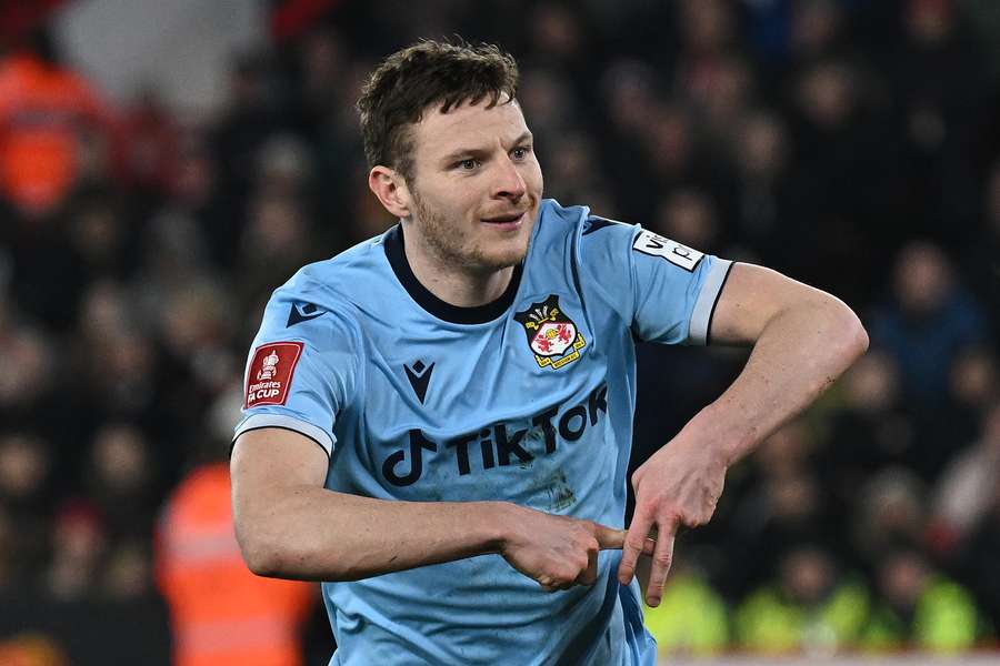 Wrexham's English striker Paul Mullin celebrates after scoring the equalising goal from the penalty spot 