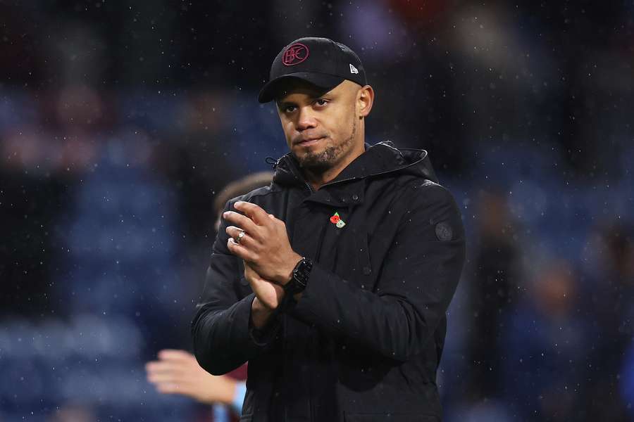 Burnley manager Vincent Kompany applauds the fans at full-time