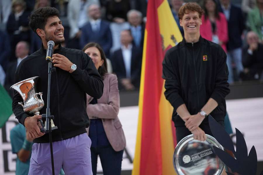 Alcaraz (L) and Sinner with their silverware